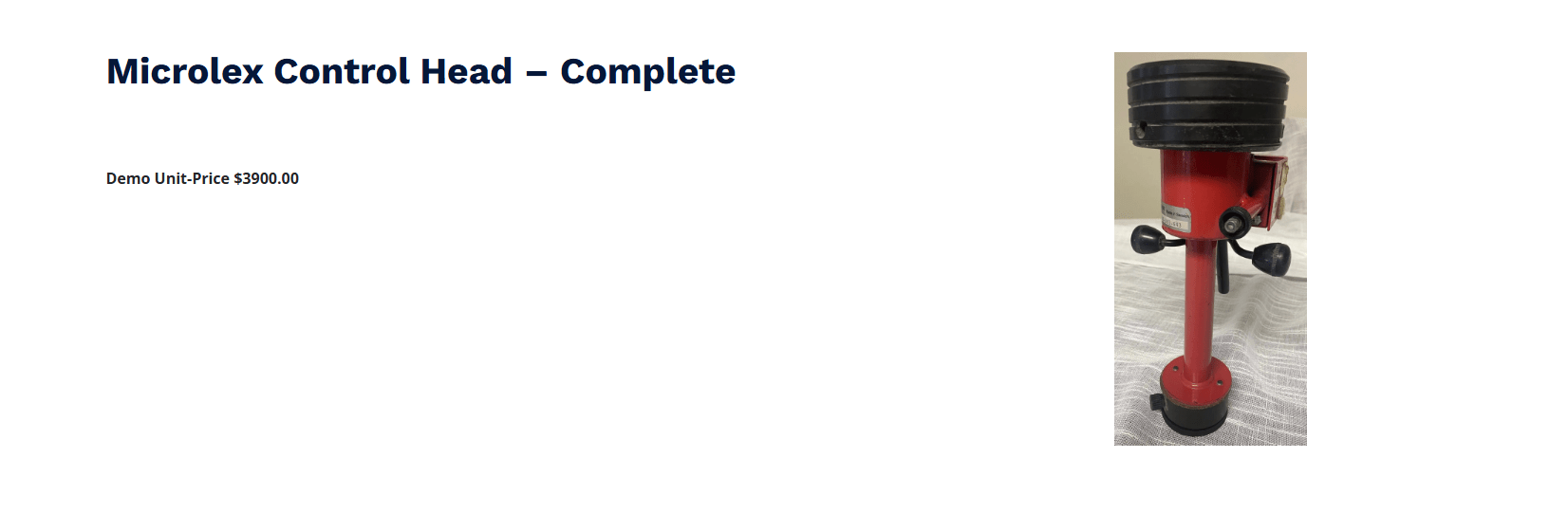 Microlex Control Head displayed on a table, showcasing its red metallic structure. Priced at $3,900 for a demo unit.